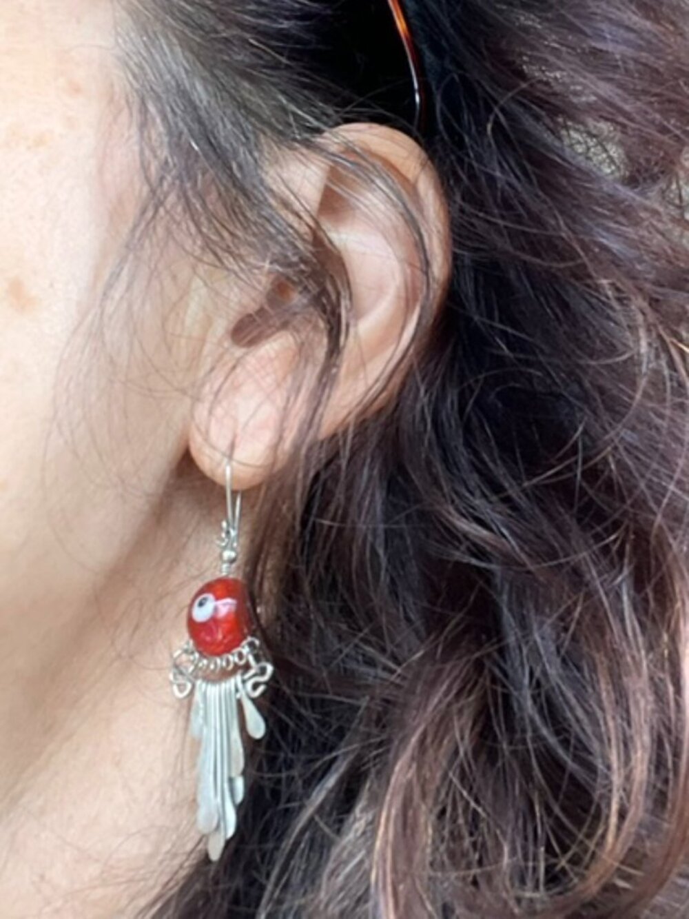 Red accent drop earrings with silver fringe